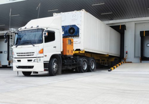 Refrigerator Truck Freezing Food. Transporting goods in the loading goods of the freezing warehouse. Storage for Ready-made foods or Ready-to-Eat Foods. Export-Import Logistics system concept.